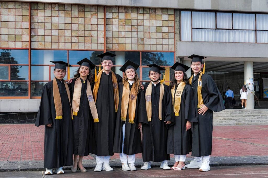 free photo of university students in gowns after graduation